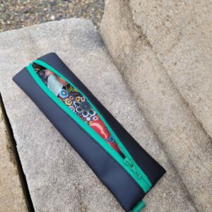 Mini estuche, guarda maquillaje bolso, o guarda lapiceros.
